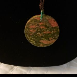 Green disc w/ brown cord